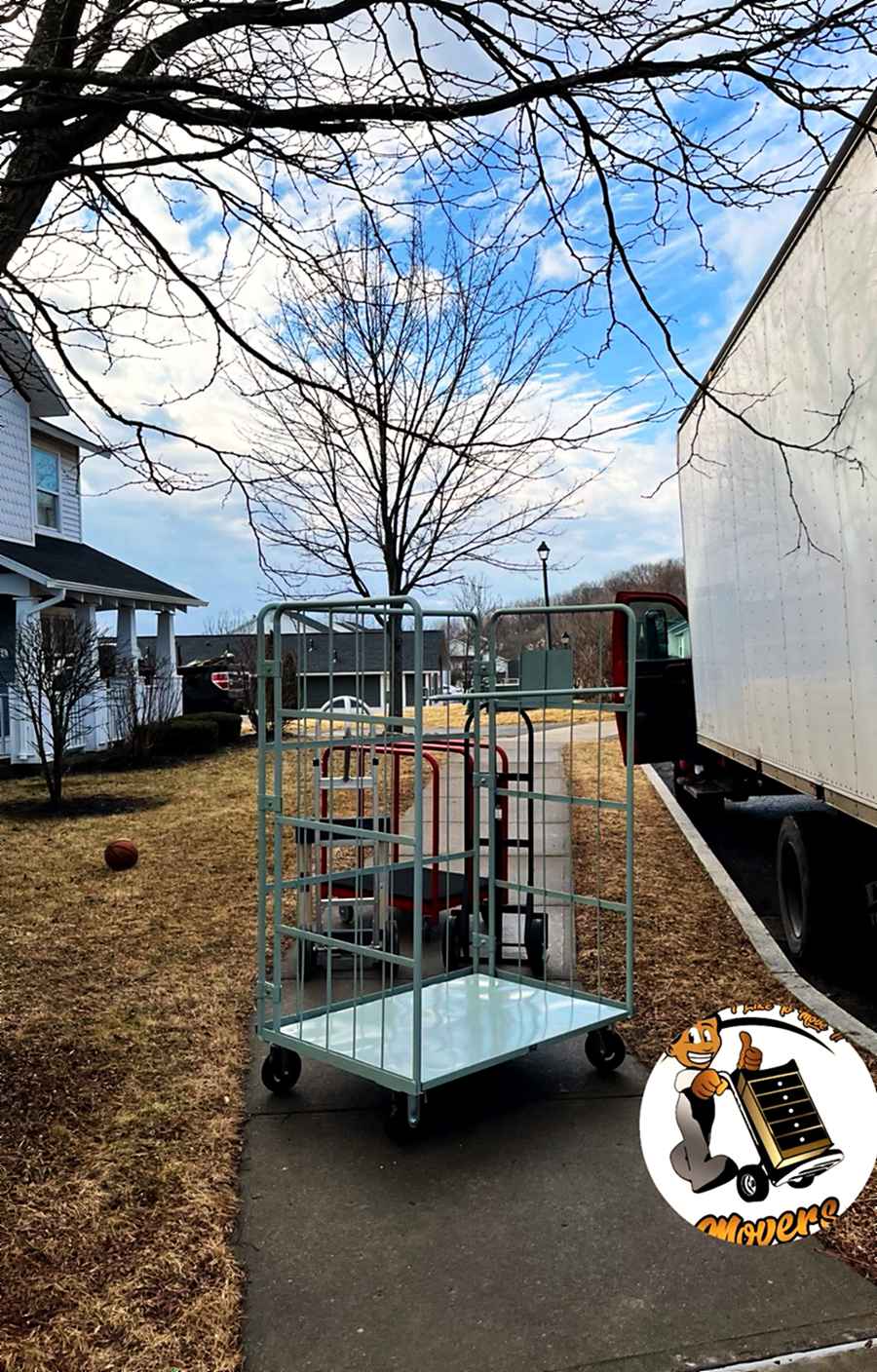 A rolling cart staged at the tailgate on a residential job